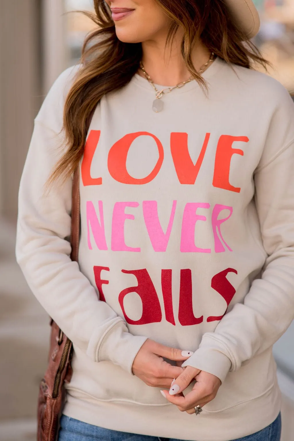 Love Never Fails Graphic Crewneck