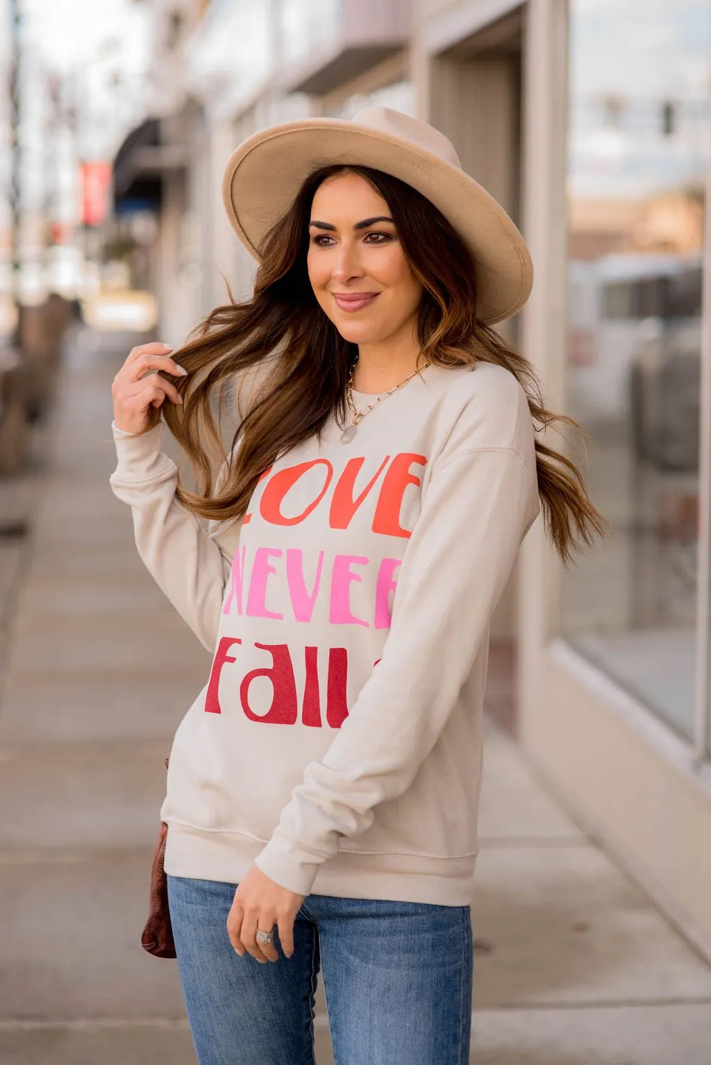 Love Never Fails Graphic Crewneck